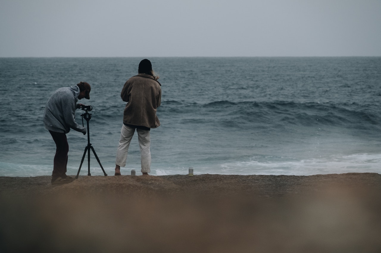 Couple recording the waves