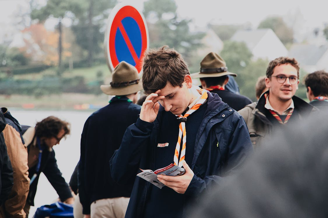 Young man reading flyer